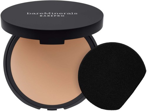 A compact with pressed powder and a black sponge applicator for makeup. The box is black with white text.