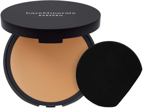 A compact powder foundation with a reusable black case and an applicator sponge.