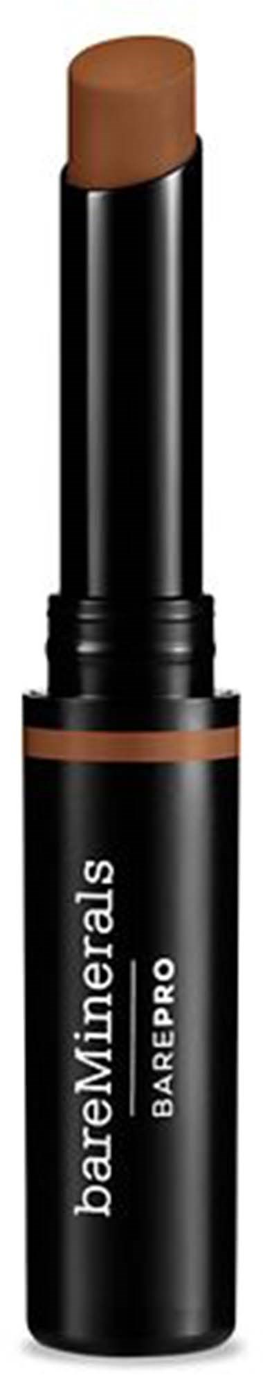 En brun sminkprodukt på ett svart rör märkt "bareMinerals BAREPRO".