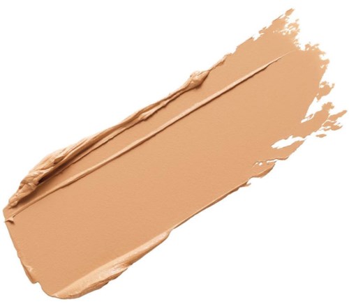 Ett beige sminkgrundfärgprov med en slät yta och ett tydligt penseldrag.