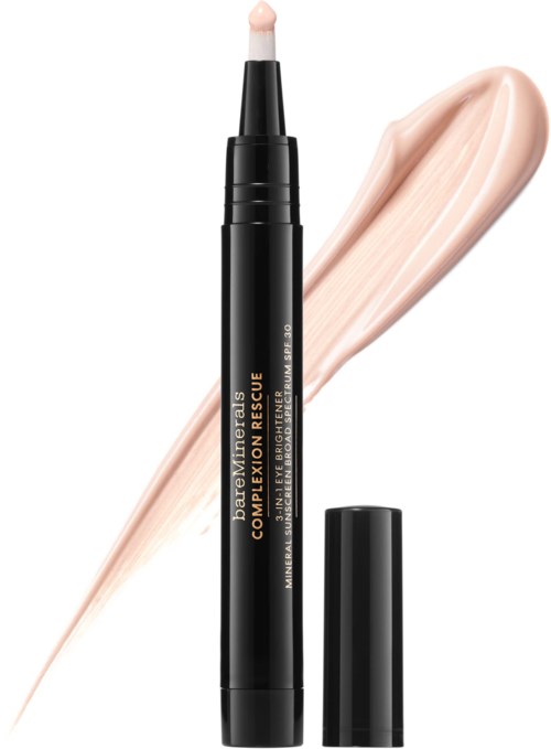 Svart läppstiftpenna med beige läppstiftsprov och krämfärgad sminkprodukt.