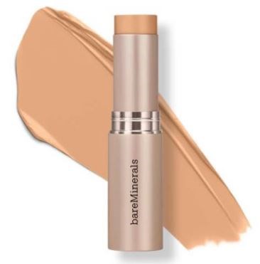 Beige BareMinerals-meikkivoide ja selän takana maskara.