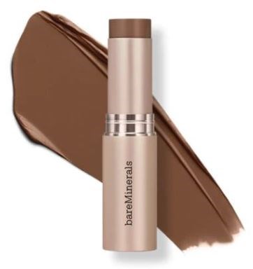 En beige tub från BareMinerals med brun lock, bredvid ett drag av brun makeup.