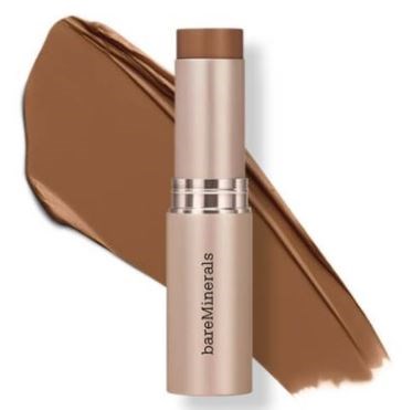 En beige pinne av BareMinerals makeup med ett bakgrundssläpp av chockoblå färg.