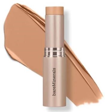 En tube med bareMinerals läppstift med en swatch av persikofärgad läppstift bakom.