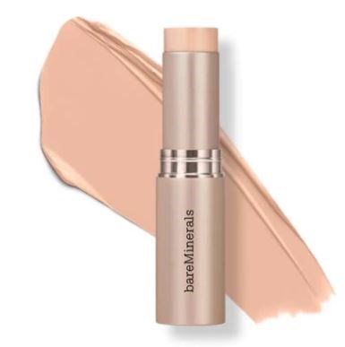 En beige stift av BareMinerals foundation med ett prov av produkten bakom den.
