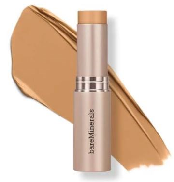 En beige stift bredvid en stor fläck av ljusbrunt sminkprodukt. Stiftet är märkt 'bake sure minerals.'