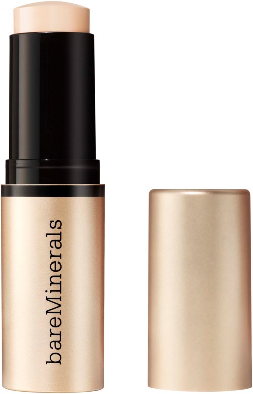 BareMinerals-produkt med beige stav och svart lock, troligen ett make-up eller hudvårdsprodukt.