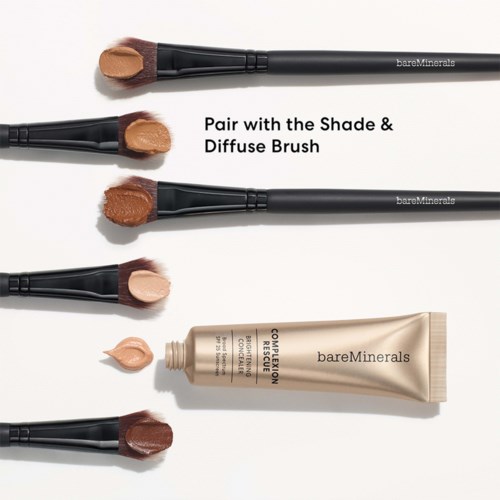 Four makeup brushes with different shades of foundation and a tube of bareMinerals complexion rescue.