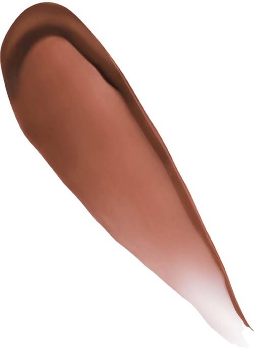 A makeup brush with brown and white bristles, applying foundation or blush on skin.