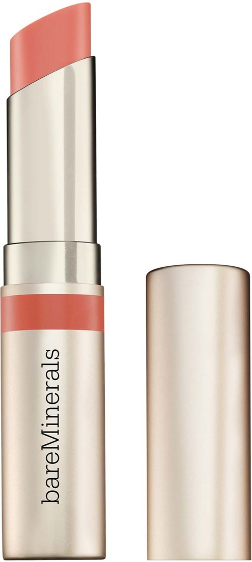 A beige lipstick with a pinkish top, labeled 'bareMinerals', has the cap removed showing the product.