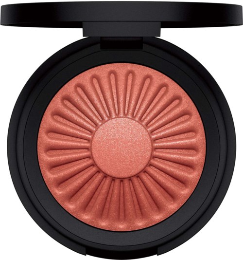 A round blush with a flower pattern, in a black container with a lid partially open.