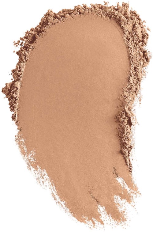 A beige powder spread unevenly with rough edges and some loose particles around.
