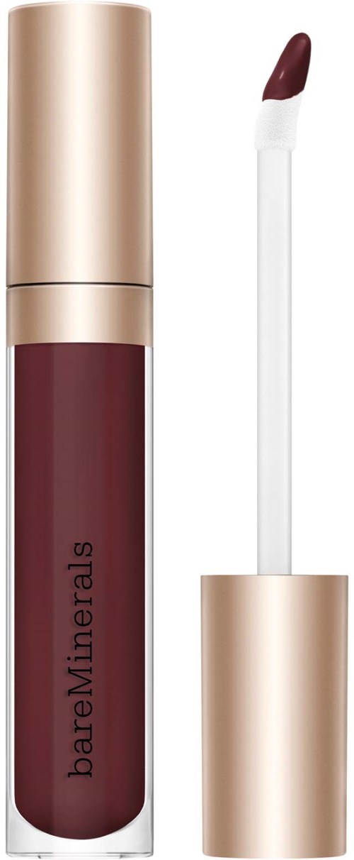 A lip gloss tube with a gold cap and dark maroon liquid inside. The applicator is shown with some product on it.
