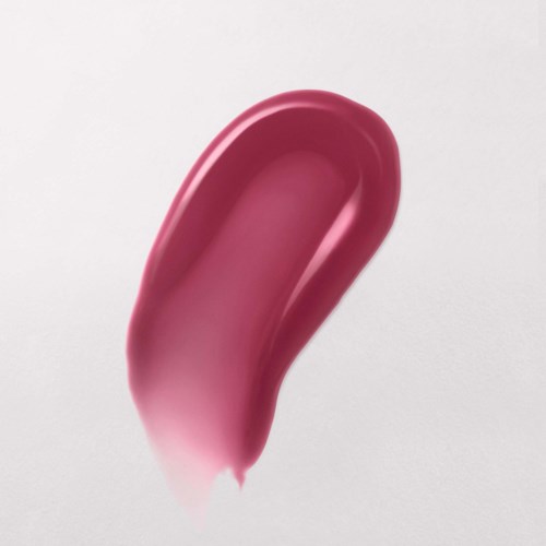 A pink, curved object with a smooth surface, possibly a personal care item, on a light background.