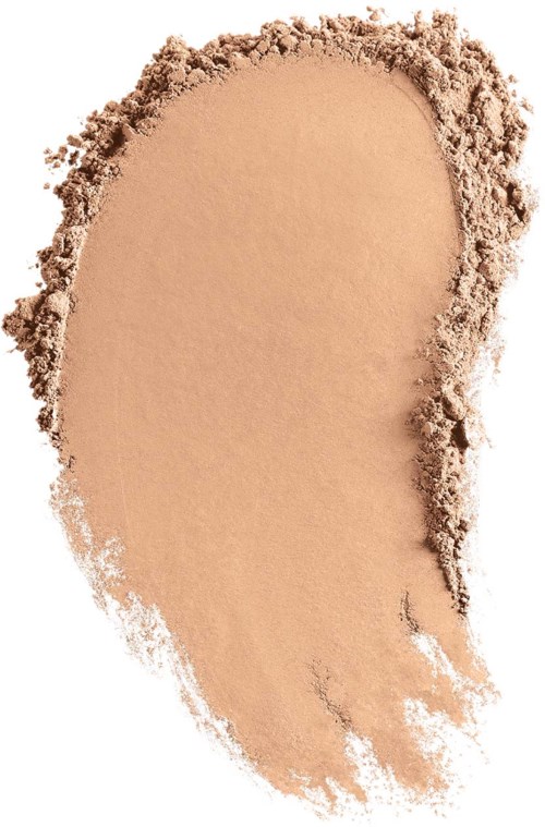 Ein beige Pulverbrei auf einem weißen Hintergrund, ungleichsam verteilt.