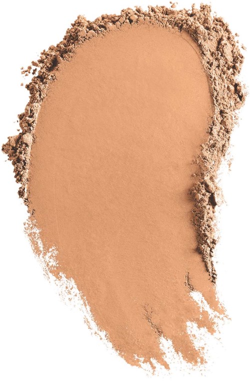 Ein sandfarbenes Make-up- oder Gesichts puder verteilt mit glatter, gebogener Kante und losen Partikeln.