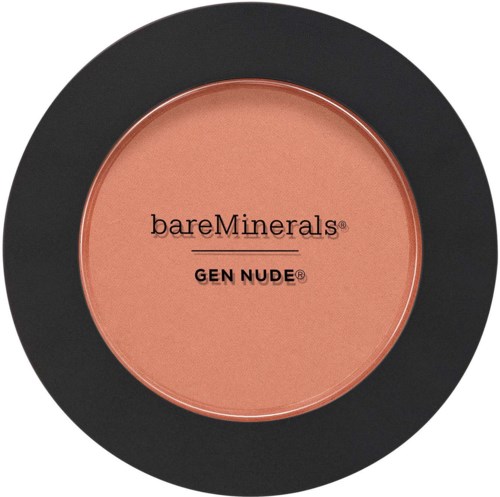 A round blush container from bareMinerals GEN NUDE line, with soft peach-colored makeup inside and a black outer rim.