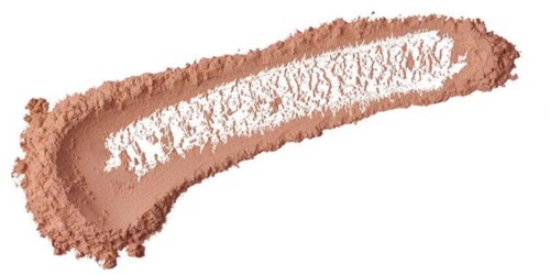 A streak of light brown makeup or powder with white inside, spread unevenly on a white background.