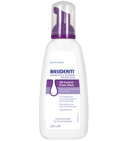 A white bottle with purple cap and pump, labeled as Basiderm Oil Control Foam Wash for sensitive, prone skin, with calming formula.