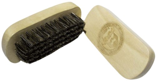 A cleaning brush with a wooden handle and black bristles, and a separate wooden handle with a seal or logo.