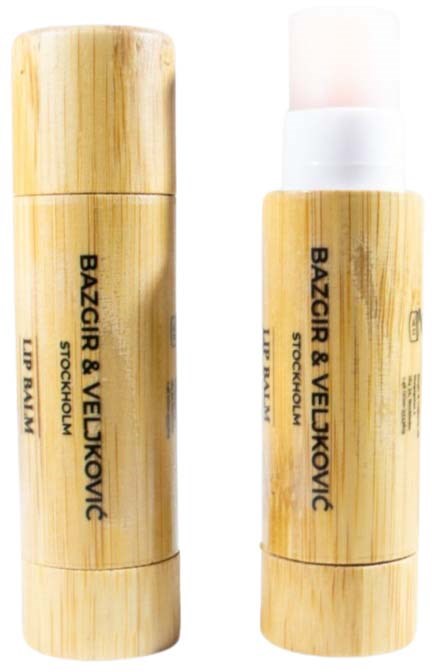Two bamboo-colored lip balm tubes with black text and white caps, one with the cap on and one with the cap off.