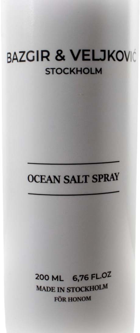 A white bottle with black text for ocean salt spray, made in Stockholm, 200 ml size.