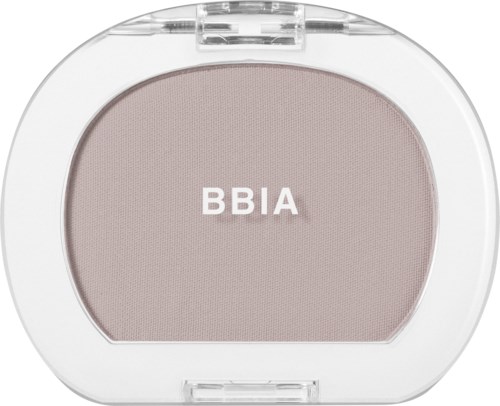 A small, round makeup item with a white case, light pink product, and the label BBIA on top.