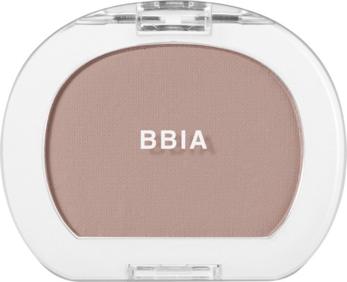 A blush compact with the letters BBIA on the product, housed in a round white case.