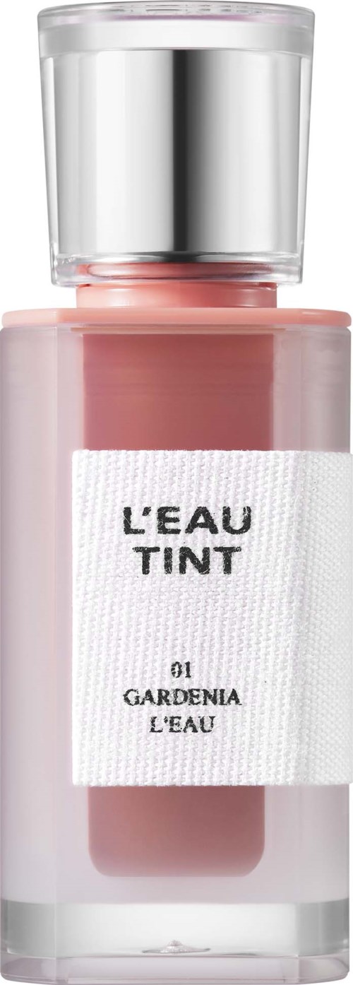 Eine pinke Kosmetikflasche mit der Aufschrift 'L'EAU TINT' und silbernem Deckel.