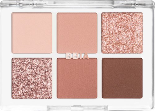 Een make-uppalette met zes tinten, inclusief roze, bruin en glitter, in een doorzichtig geval.