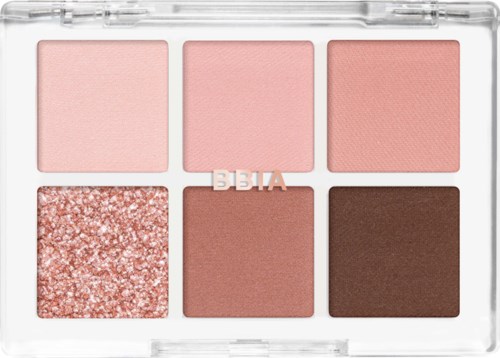 Eine Make-up-Palette mit sechs Farbtönen, darunter Rosa, Glitzer und Braun in einem transparenten Gehäuse.