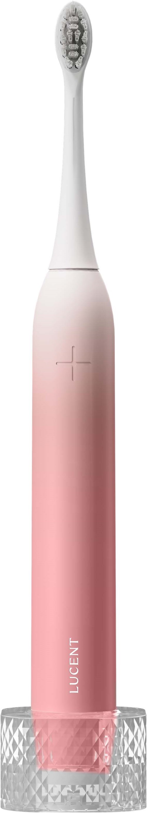 Eine rosa und weiße elektrische Zahnbürste mit rutschfestem Griff, hängt an einem grauen Ladegerät.