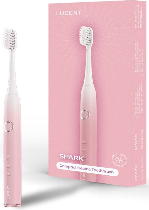 Pink compact electric toothbrush with a white head, shown both outside and in pink box, labeled 'Spark' and 'Lucent.'