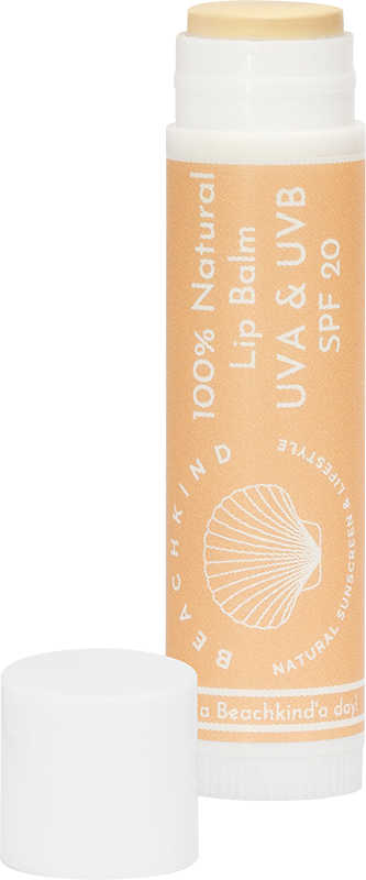 A beige lip balm tube with white label, showing SPF 20, and a white cap next to it.