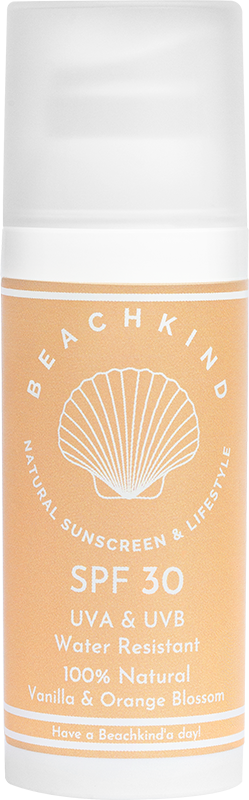 A bottle of sunscreen labeled SPF 30, with a shell logo, and ingredients vanilla and orange blossom.