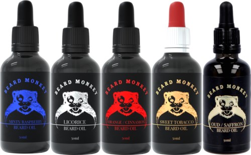 Five small bottles of beard oil with different scents, each with a black dropper cap and colorful labels.