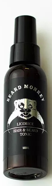A dark bottle labeled 'Beard Monkey' with a monkey face, contains beard and hair tonic, 100ml size.