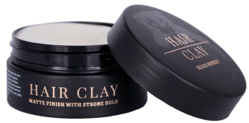 En svart krukke merket 'Hair Clay' med lokk, har en matt finish for hårstyling.