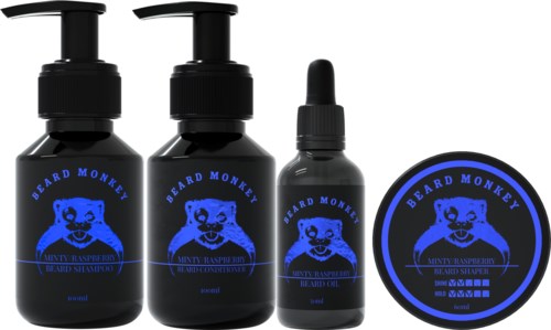 Three black bottles with blue labels and a round container, all with a bearded monkey logo and product names written.