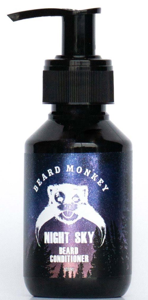A black bottle with a pump shows beard conditioner called 'Night Sky' by Beard Monkey, featuring a monkey logo and night sky background.
