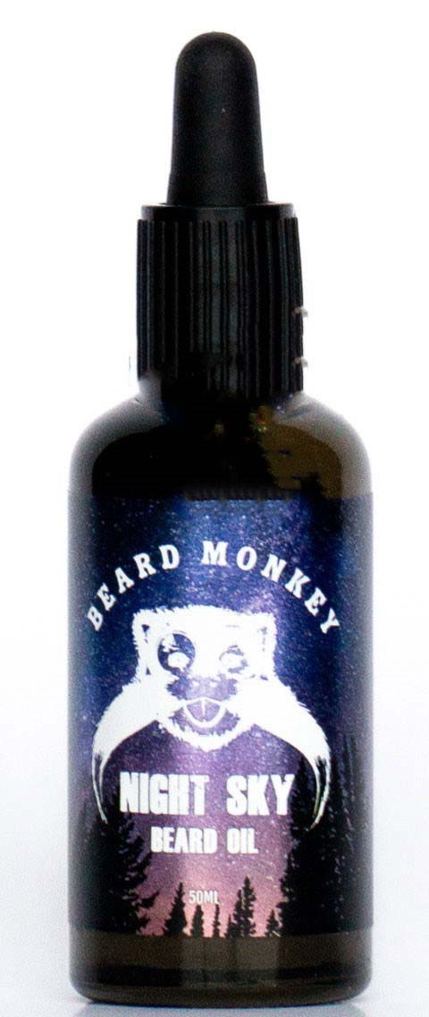 Kleine dunkle Flasche mit Tropfer, beschriftet 'Beard Monkey Night Sky Beard Oil' mit Affengesicht und Bäumen.