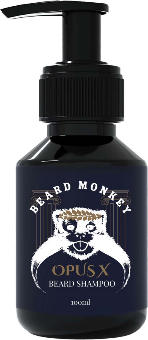 A dark blue bottle with a pump, labeled 'Beard Monkey Opus X Beard Shampoo,' featuring a monkey logo.
