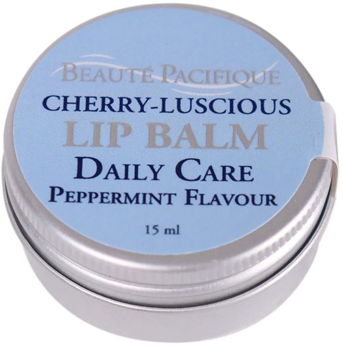 A small round container of lip balm labeled with cherry flavor, peppermint, and daily care, 15 ml.