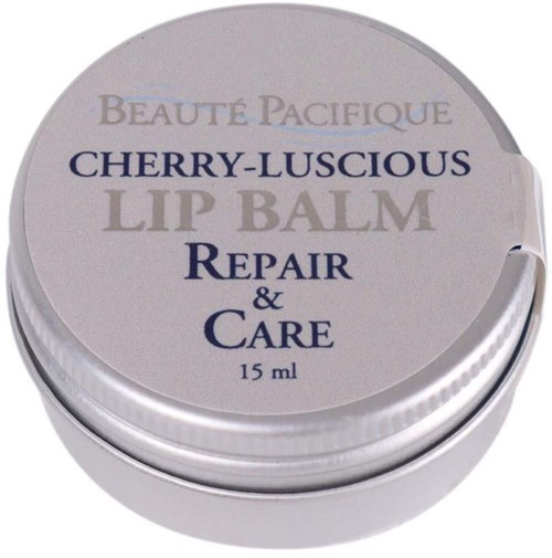 A small round container of cherry-scented lip balm with repair and care benefits, 15 ml size.