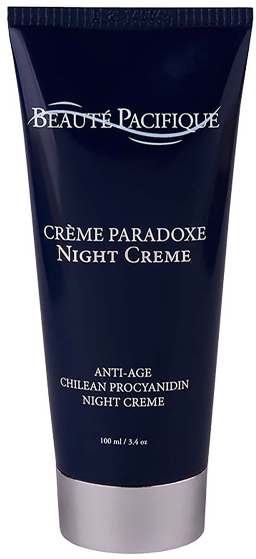 Een donkerblauwe tube met het label 'Beauté Pacifique Crème Paradoxe Night Creme' voor anti-aging. De dop is zilverachtig.