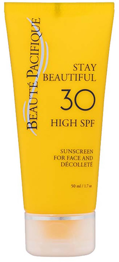 Eine gelbe Sonnencremetube mit schwarzen und weißen Text, SPF 30, für Gesicht und Dekolleté.