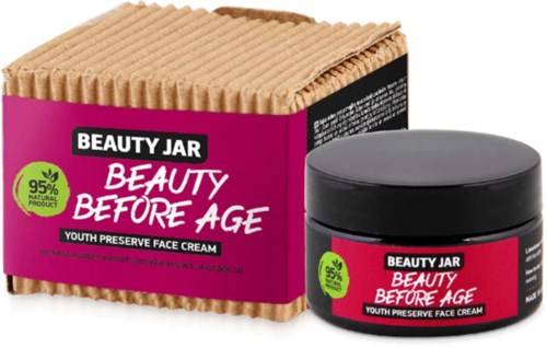 Ein pinker und schwarzer Behälter mit passender Box mit dem Titel 'Beauty Before Age,' fördert jugendserhaltende Gesichtscreme aus 95 % natürlichen Inhaltsstoffen.