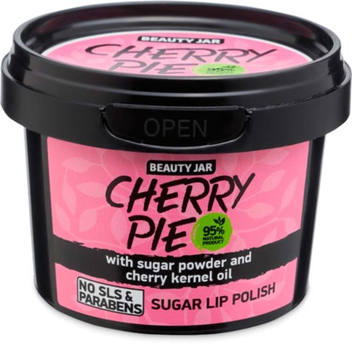 Ein rosa-schwarzer Behälter mit Kirschkuchen-Geschmack für Lippenpolitur mit Kirschkernenöl und 95 % natürlichen Inhaltsstoffen.