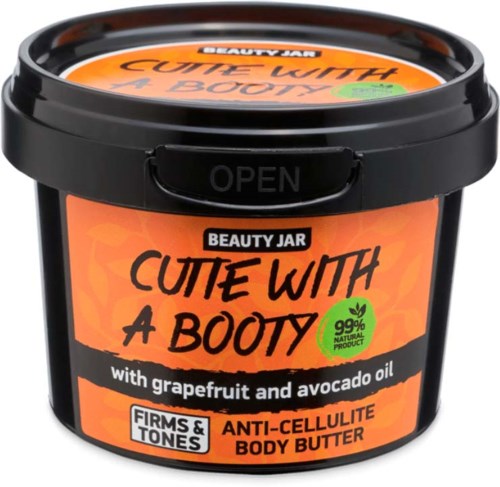 Eine schwarze runde Dose mit orangefarbenem Etikett, verkauft Körperbutter mit Grapefruit- und Avocadoöl für Straffung und Cellulite.